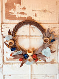 DECORATIVE WOVEN TWIG WREATH WITH COLORFUL ACCENTS