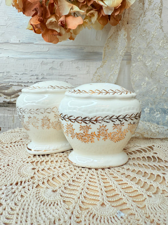 SET OF GOLD FLORAL SHAKERS