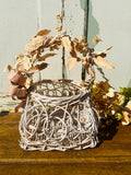 ORNATE BOW AND LEAF WICKER VINTAGE BASKET
