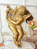 Large cherub with harp wall decor ￼
