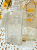 PAIR OF ANTIQUE GLASS BOTTLES