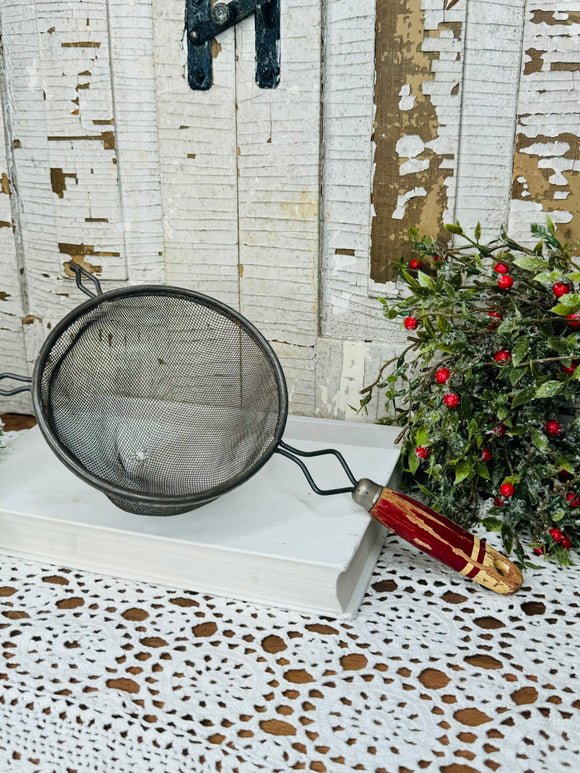 LARGE RED HANDLED ANTIQUE SIFTER