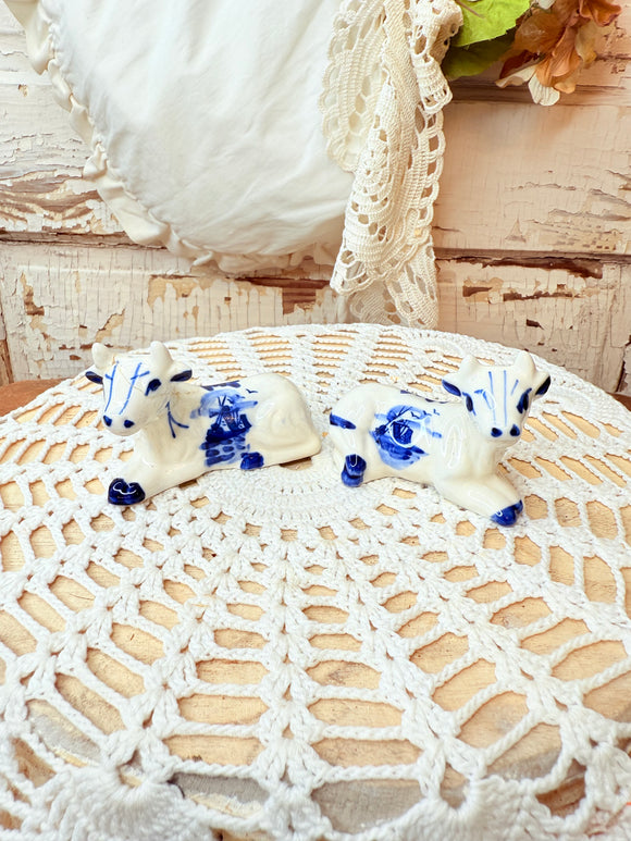PAIR OF VINTAGE DELFT COW SALT AND PEPPER SHAKERS