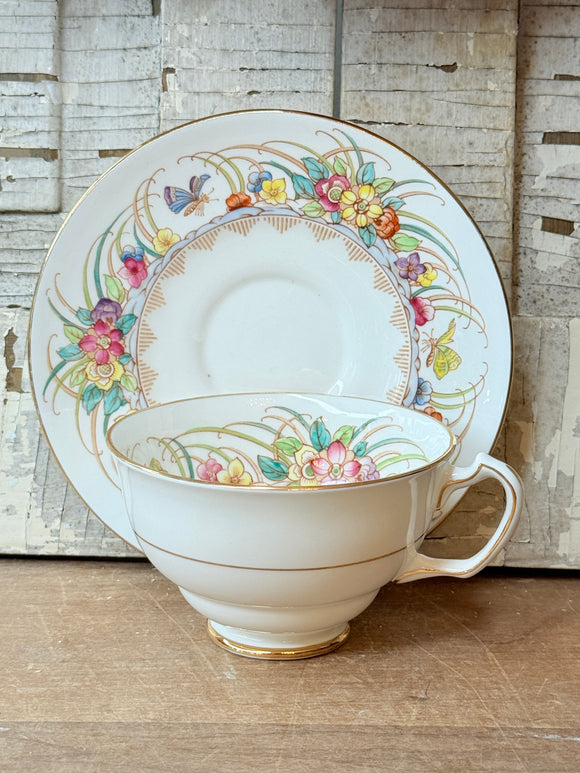 FLORAL MADE IN ENGLAND ORNATE TEACUP AND SAUCER SET