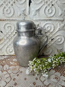 ANTIQUE ALUMINUM CANISTER WITH ORNATE DETAIL