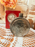 VINTAGE AVON BOTTLE SILVER COIN