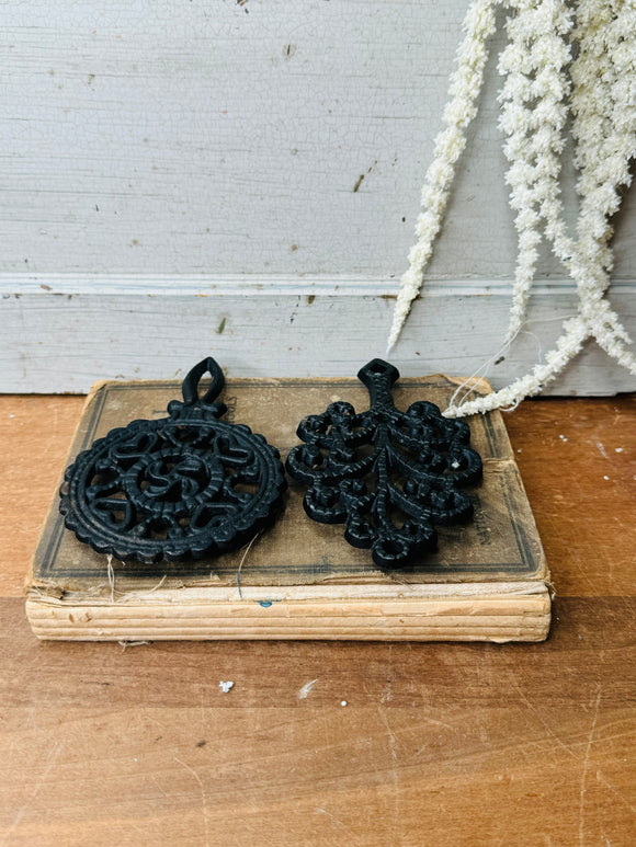 PAIR OF VINTAGE CAST IRON ORNATE TRIVETS