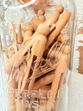 VINTAGE GLASS JAR OF CLOTHESPINS
