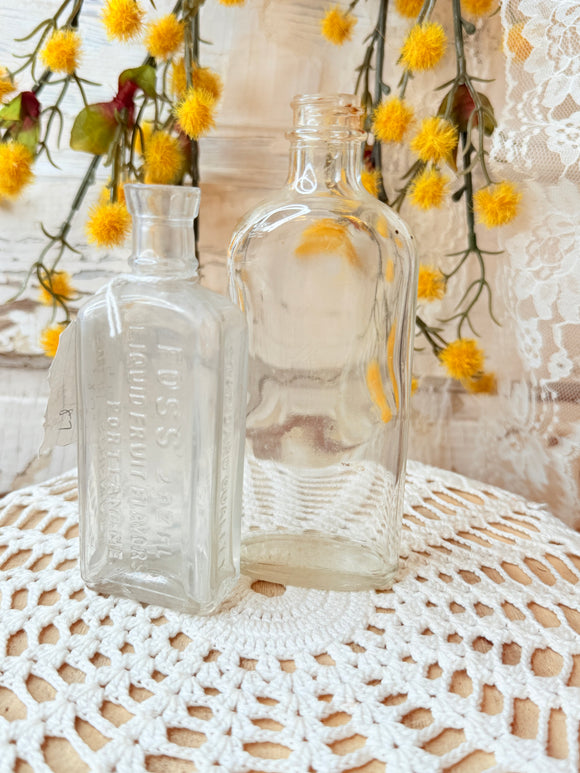 PAIR OF ANTIQUE GLASS BOTTLES