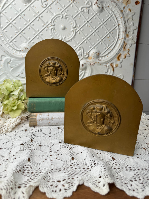 SET OF UNIQUE VINTAGE BRASS FACE BOOKENDS