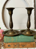 PAIR OF BRASS PATINA’D CANDLESTICK HOLDERS