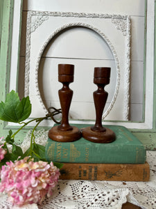 PAIR OF VINTAGE DARK WOOD DETAILED CANDLESTICK HOLDERS