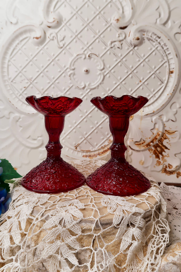 PAIR OF RED GLASS VINTAGE ORNATE CANDLESTICK HOLDERS