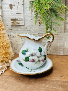 FLORAL AND GOLD VINTAGE CREAMER AND SAUCER SET