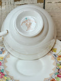 FLORAL MADE IN ENGLAND ORNATE TEACUP AND SAUCER SET