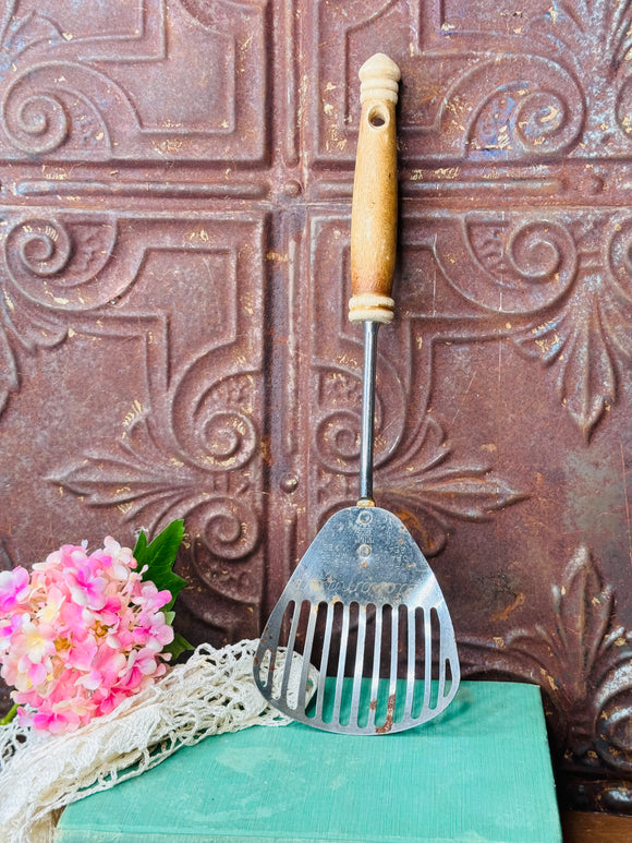 ANTIQUE SPATULA WITH WOODEN HANDLE