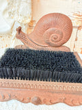 ANTIQUE CAST IRON SNAIL SHOE BRUSH
