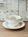 FLORAL MADE IN ENGLAND ORNATE TEACUP AND SAUCER SET