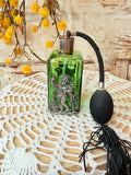 VINTAGE GREEN AND SILVER CHERUB ORNATE PERFUME BOTTLE