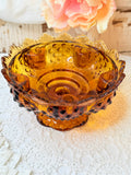 VINTAGE AMBER GLASS OR AGE HOBNAIL COMPOTE