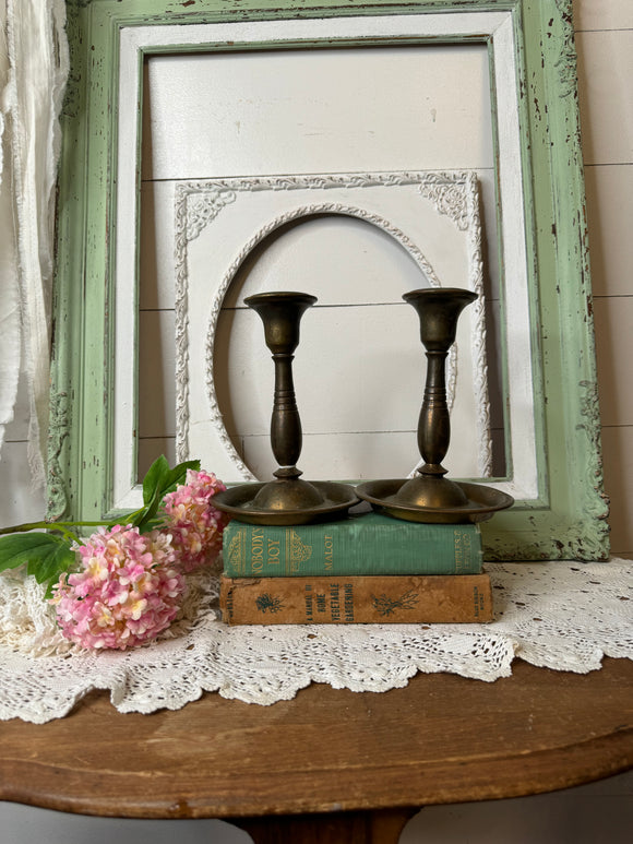 PAIR OF BRASS PATINA’D CANDLESTICK HOLDERS