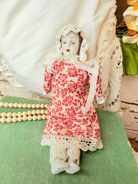 VINTAGE ORNATE DOLL WITH LACE DRESS