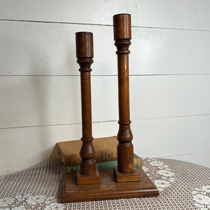 SET AND STAND OF VINTAGE OAK CANDLE HOLDERS