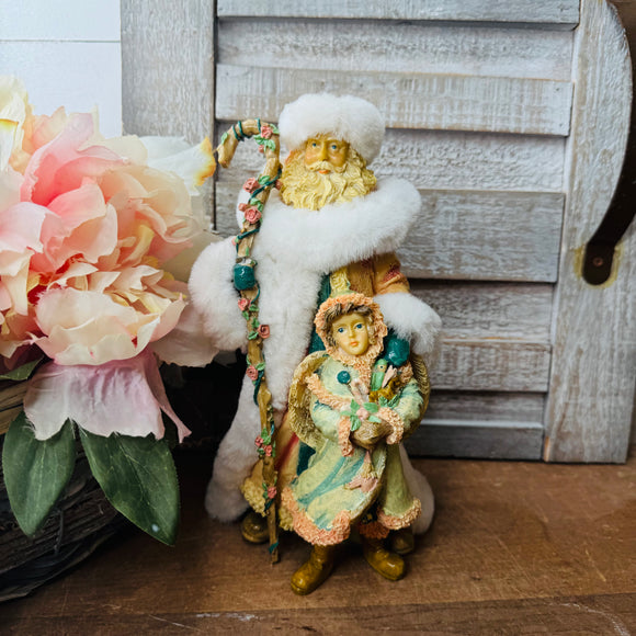 VINTAGE PASTEL SANTA AND CHILD STATUETTE