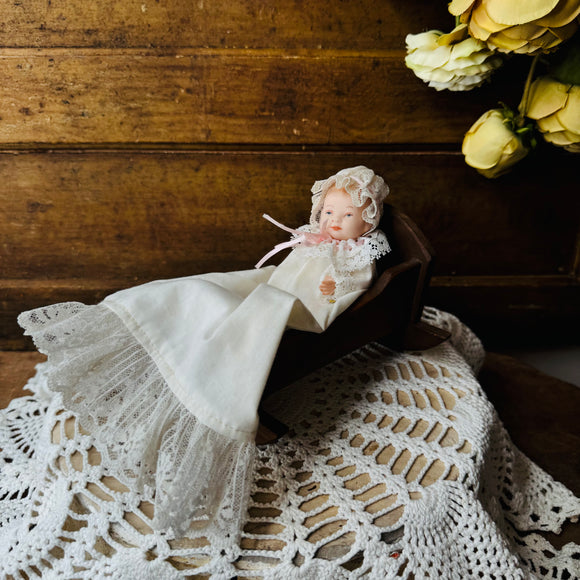 VINTAGE BABY DOLL IN WOOD BASSINET DECOR