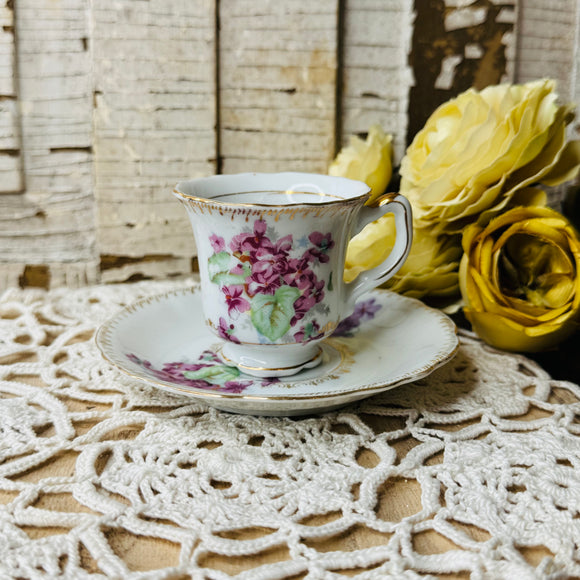 VINTAGE FLORAL AND GOLD DEMITASSE CUP AND SAUCER SET