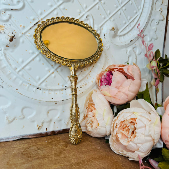 VINTAGE ORNATE GOLD TONE HAND MIRROR