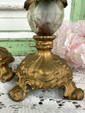 PAIR OF ANTIQUE BRASS AND CRYSTAL CANDLE HOLDERS