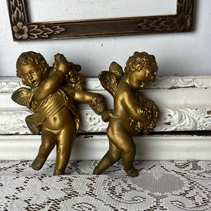 PAIR OF BRONZEY PERFECTLY PATINAD WALL CHERUBS